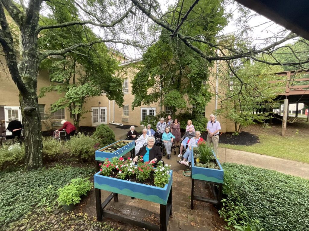 Residents enjoying time together in a garden area