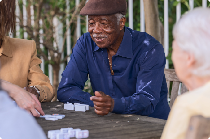 Residents enjoying a game outside on a sunny day.