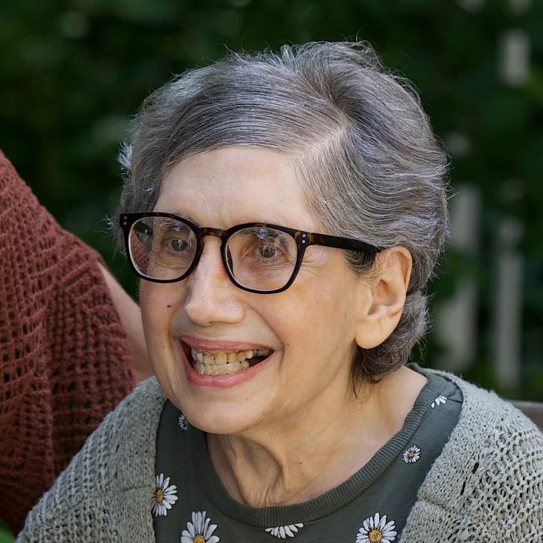 Smiling elderly woman with glasses