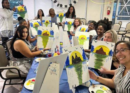 Residents engaged in a painting activity together.
