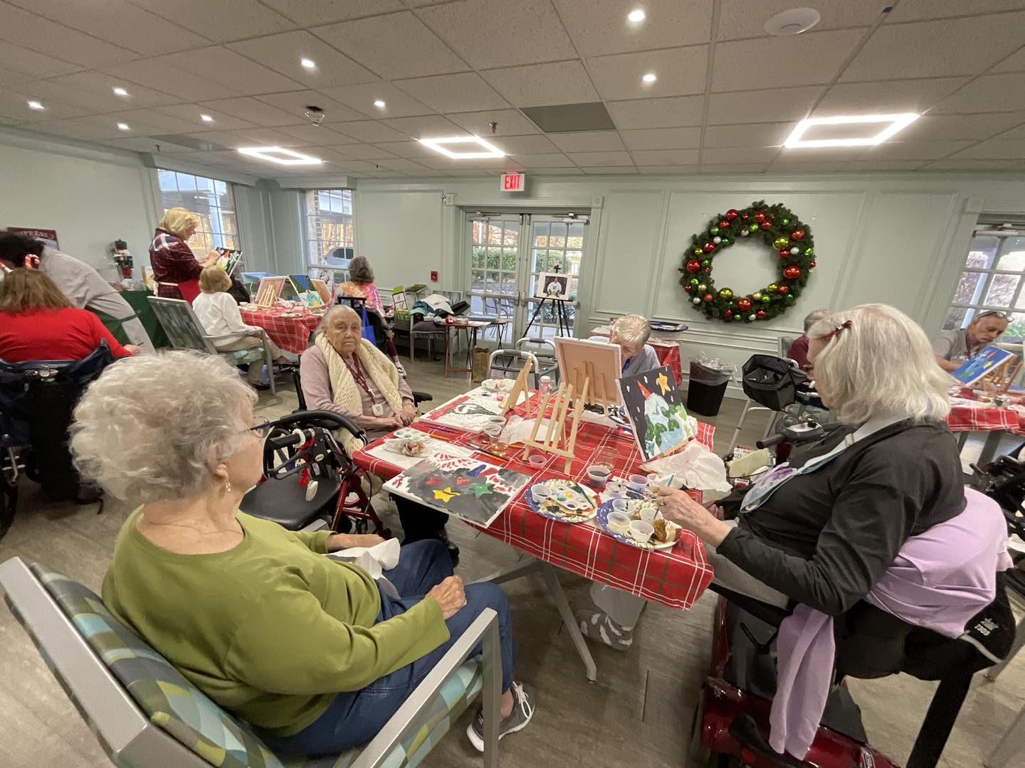 Residents engaged in an arts and crafts activity indoors