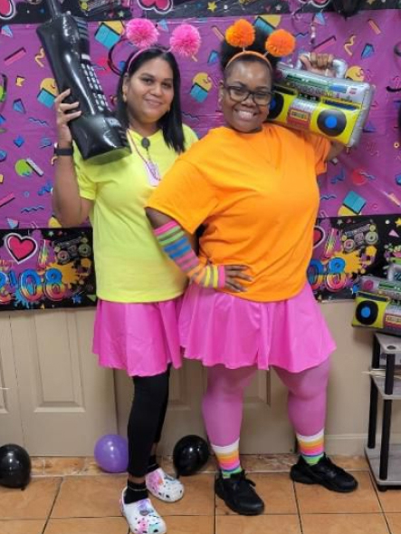 Staff members dressed in colorful costumes.