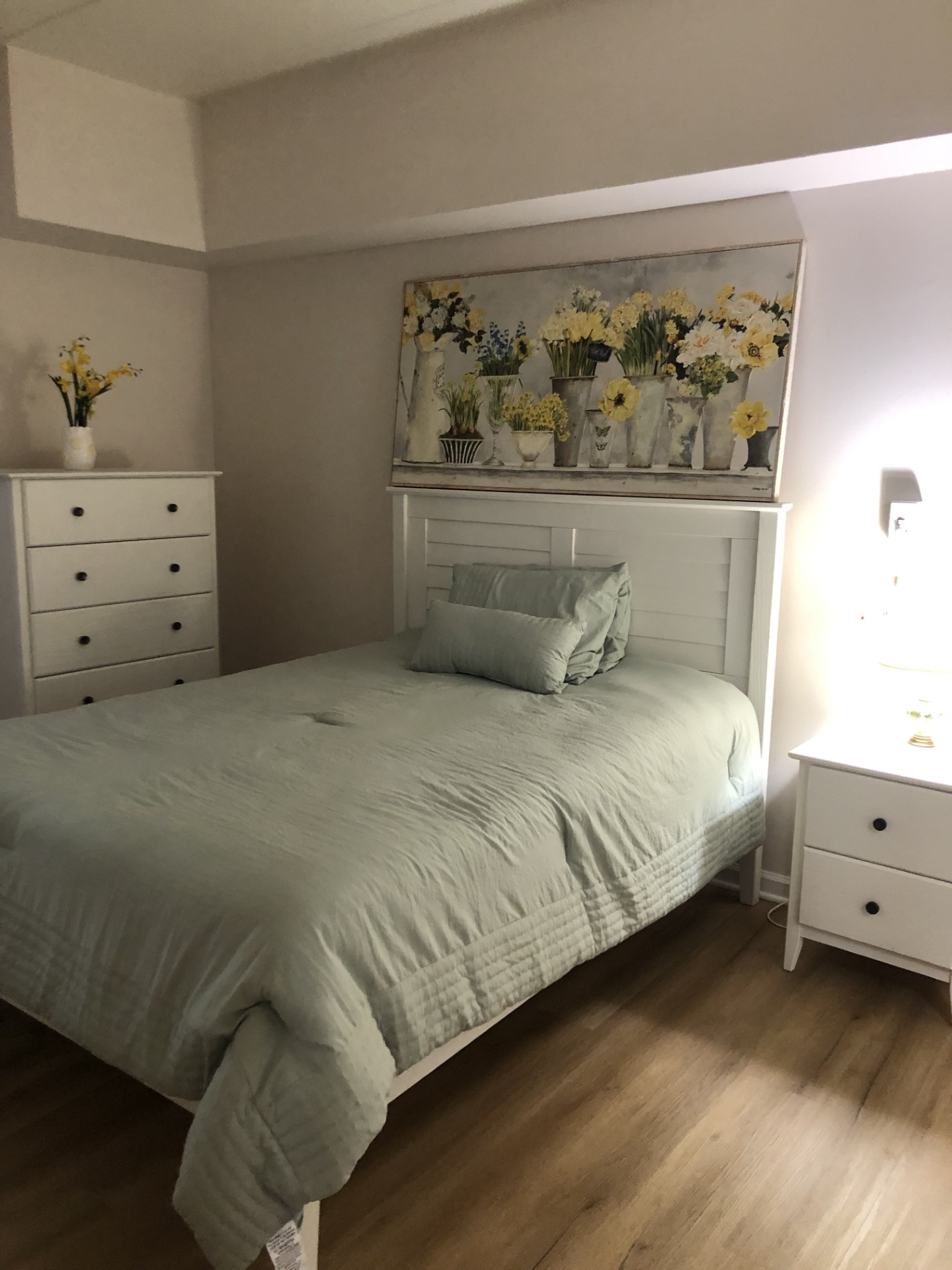 Cozy bedroom in a senior living facility with floral decor