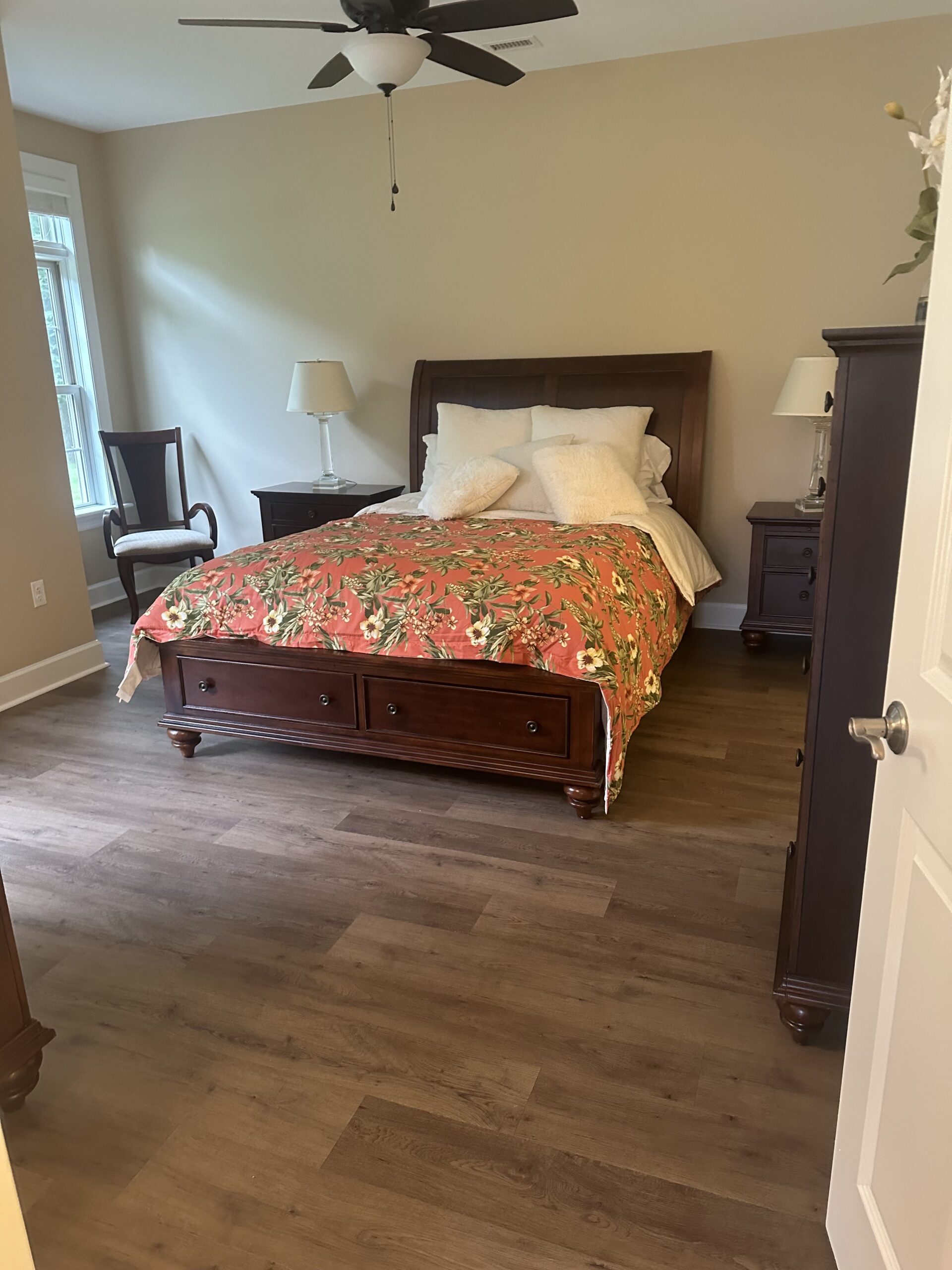 Cozy bedroom with floral bedding in a senior living facility