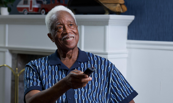 Smiling resident enjoying leisure time indoors