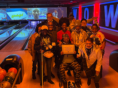Residents participating in a bowling activity