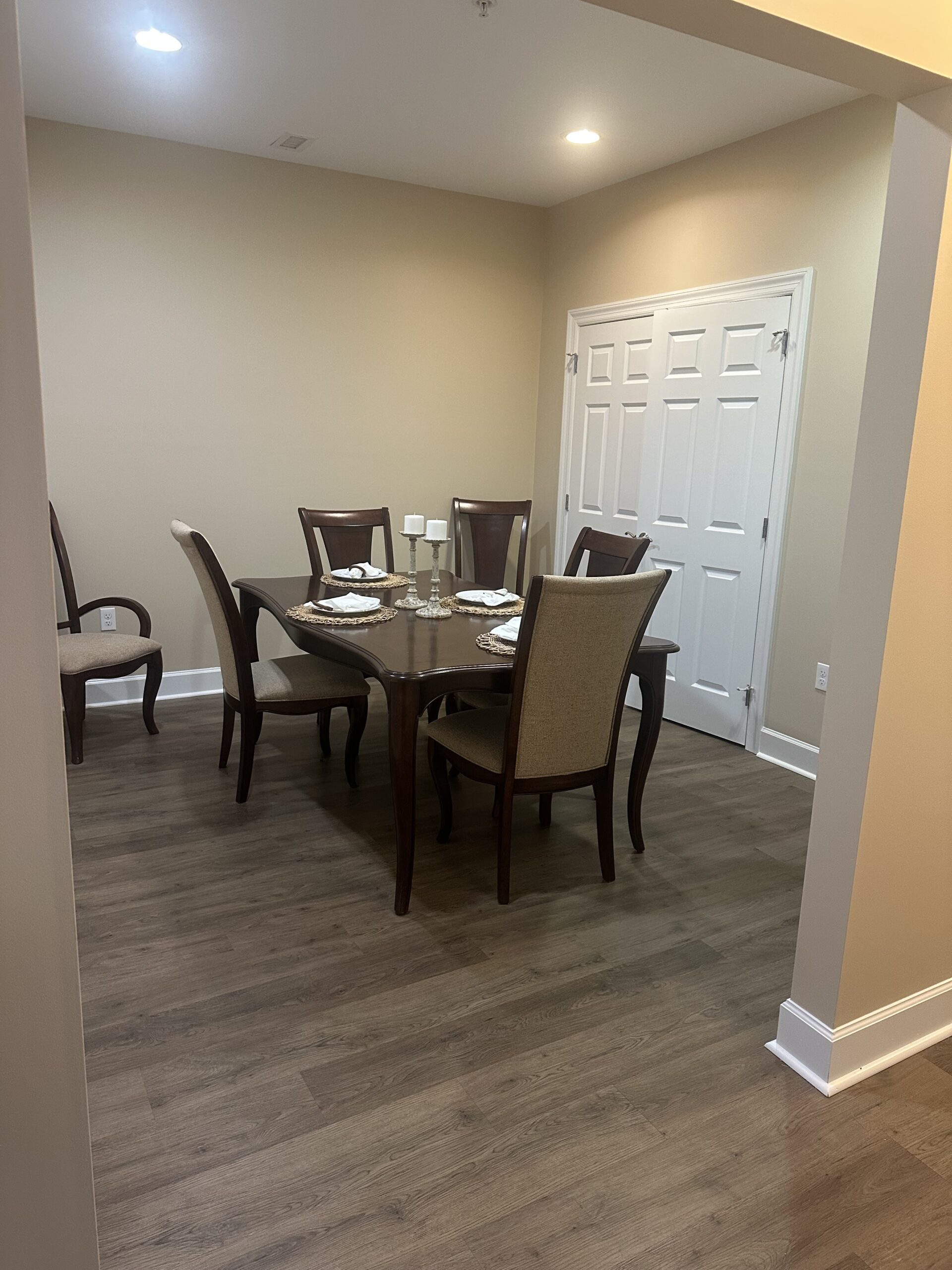 Dining area with a table and chairs in a well-lit room