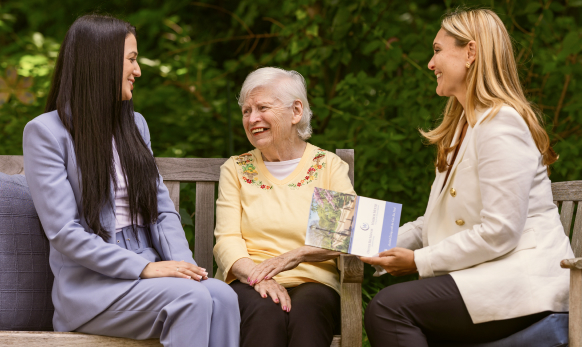 Three women enjoying conversation outdoors