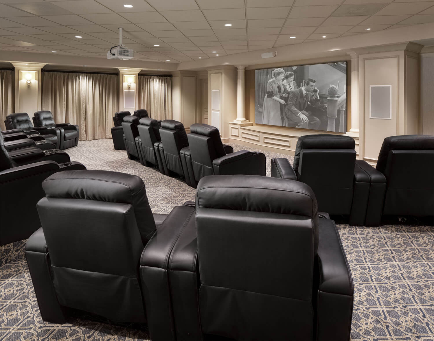 Interior view of a cozy movie theater with reclining seats