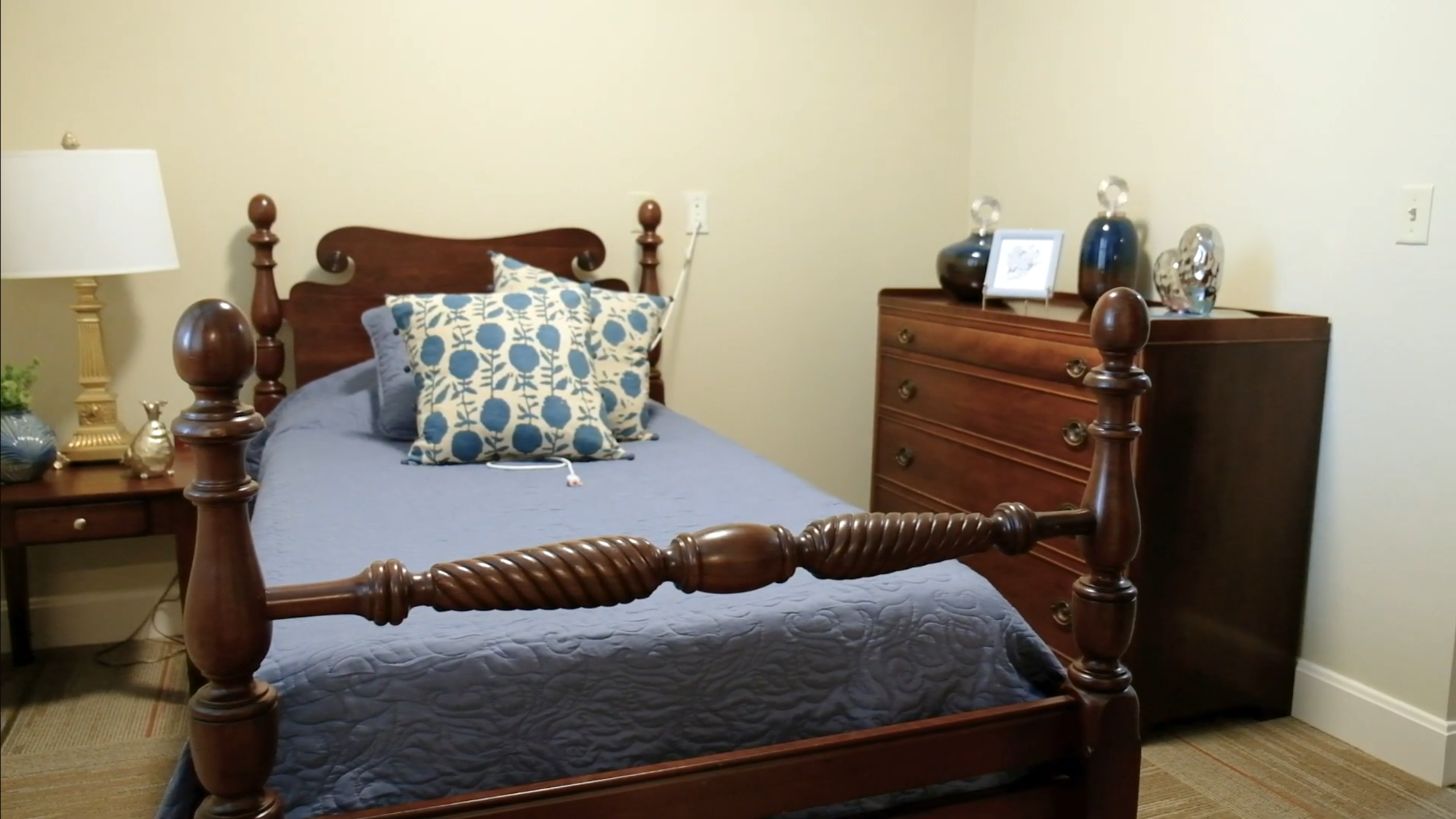 Cozy private resident room with bed and dresser