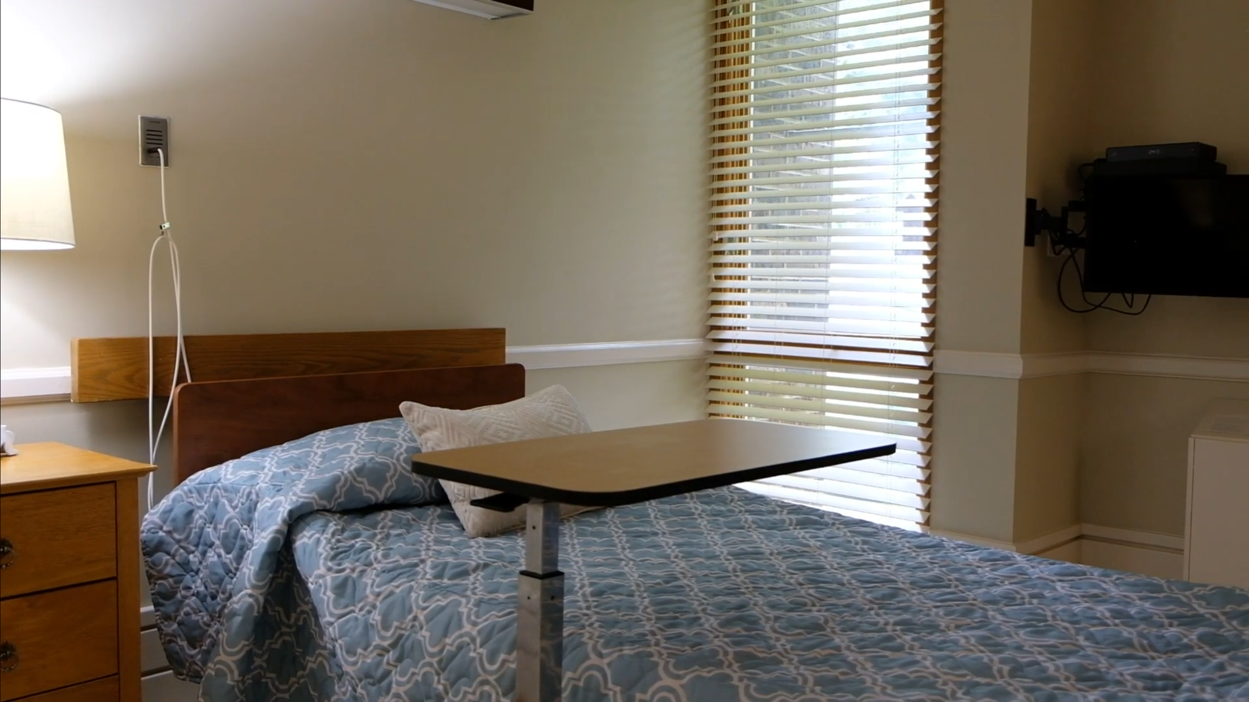 Private resident room with bed and window