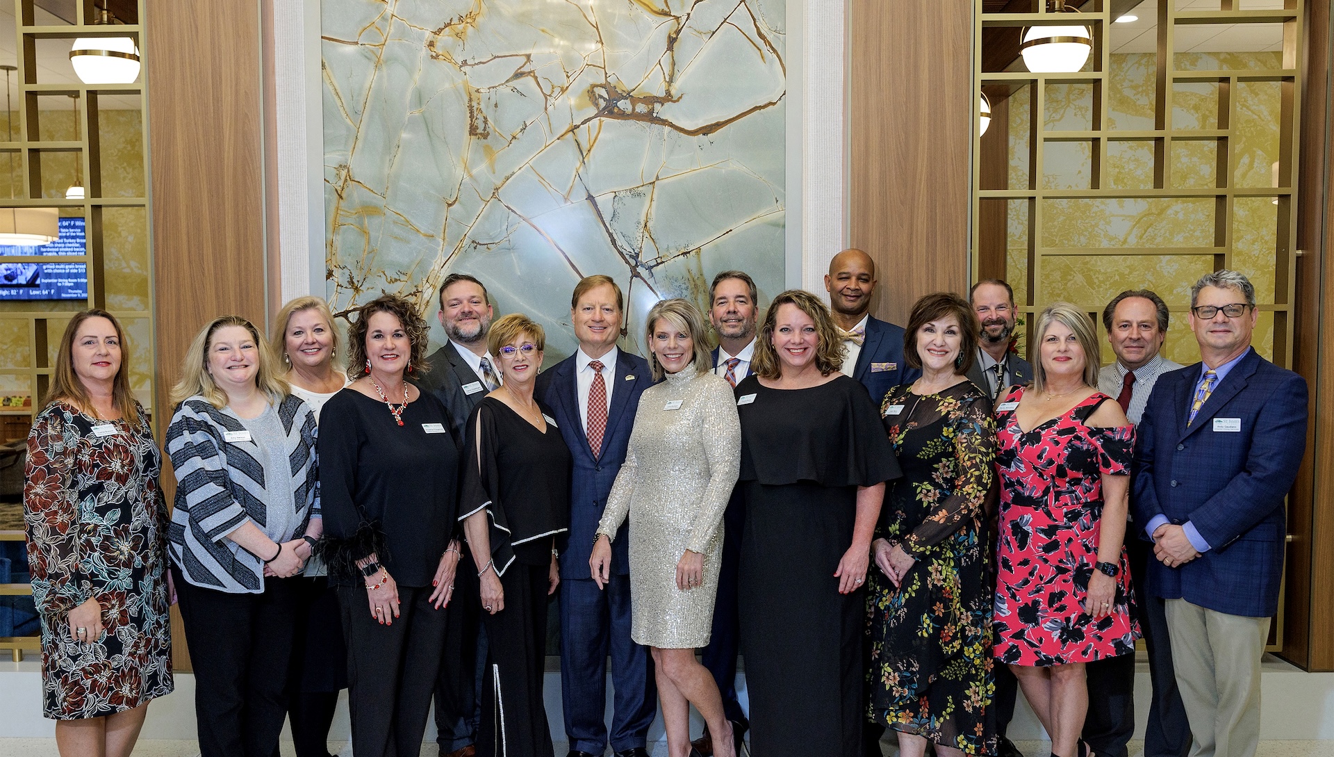 Group photo of staff members in a welcoming lobby