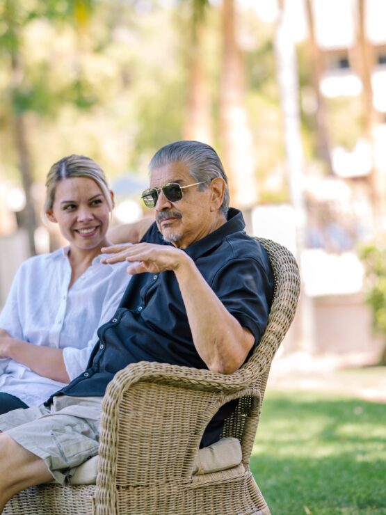Residents enjoying conversation in a garden setting