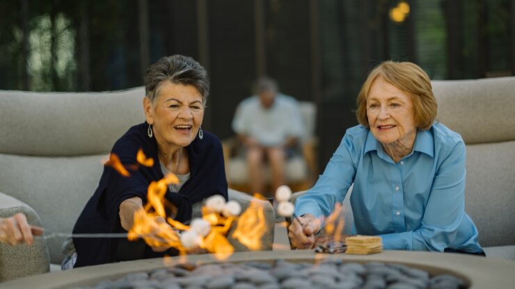 Residents enjoying a fireside activity outdoors