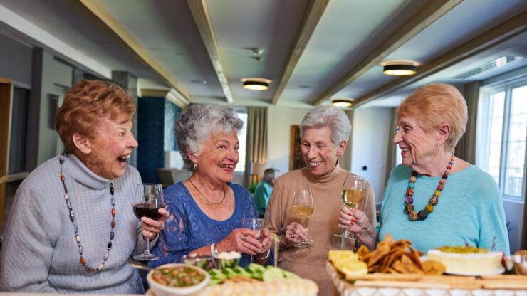Residents enjoying drinks and snacks at a social gathering