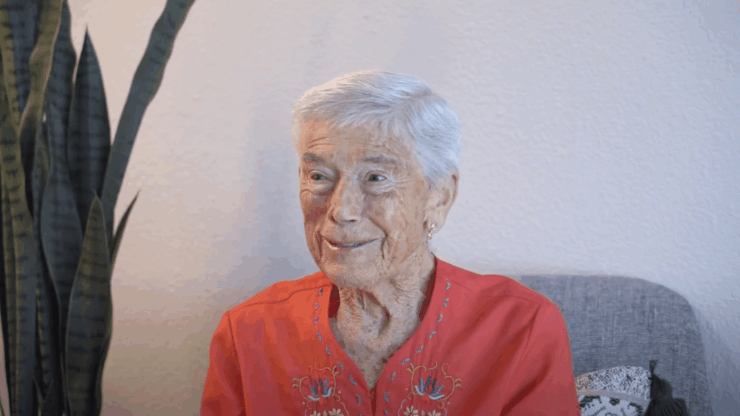 Senior woman smiling in a cozy indoor setting