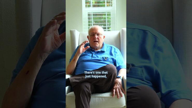 Resident sharing a story in a cozy chair
