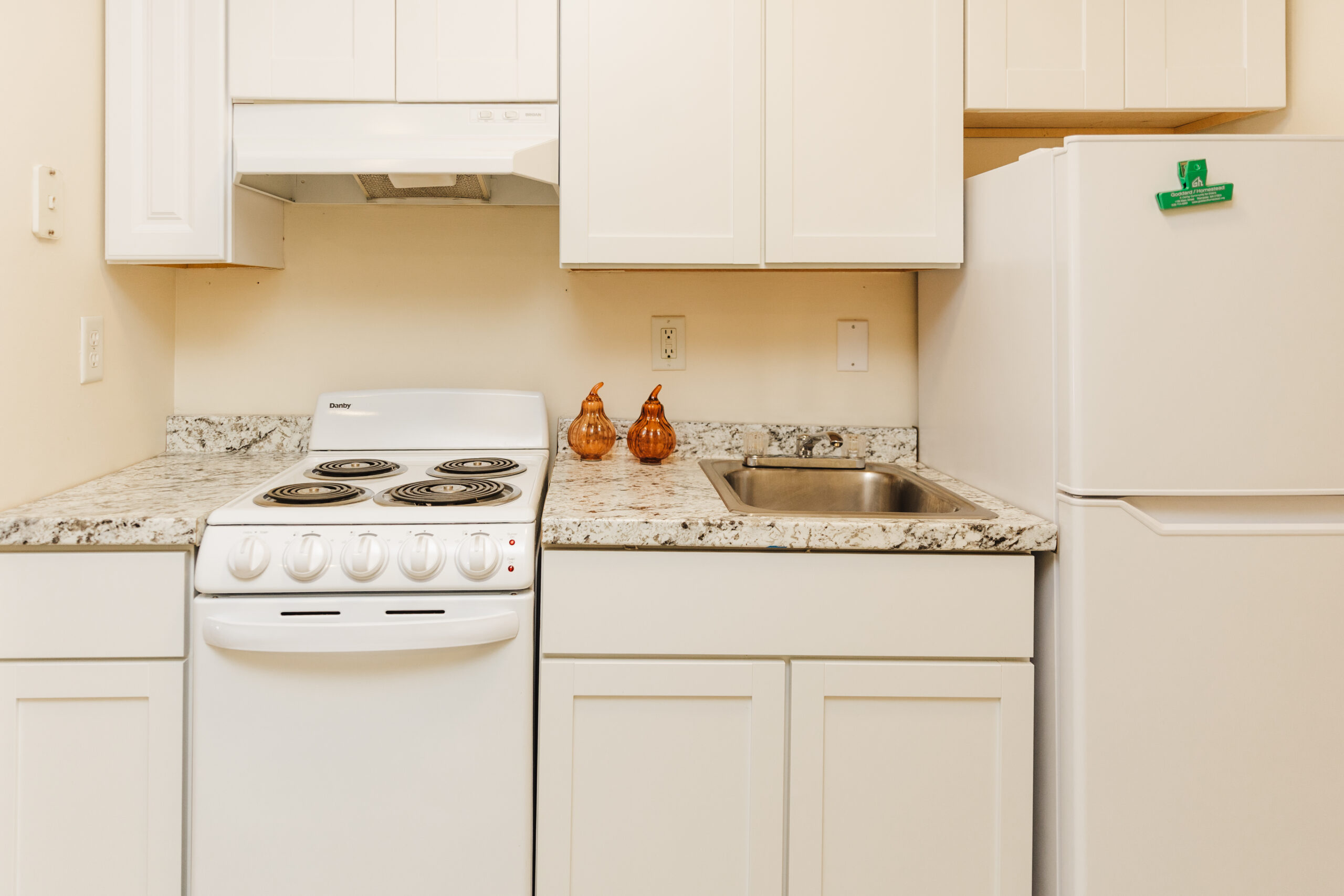 Clean kitchen area with modern appliances
