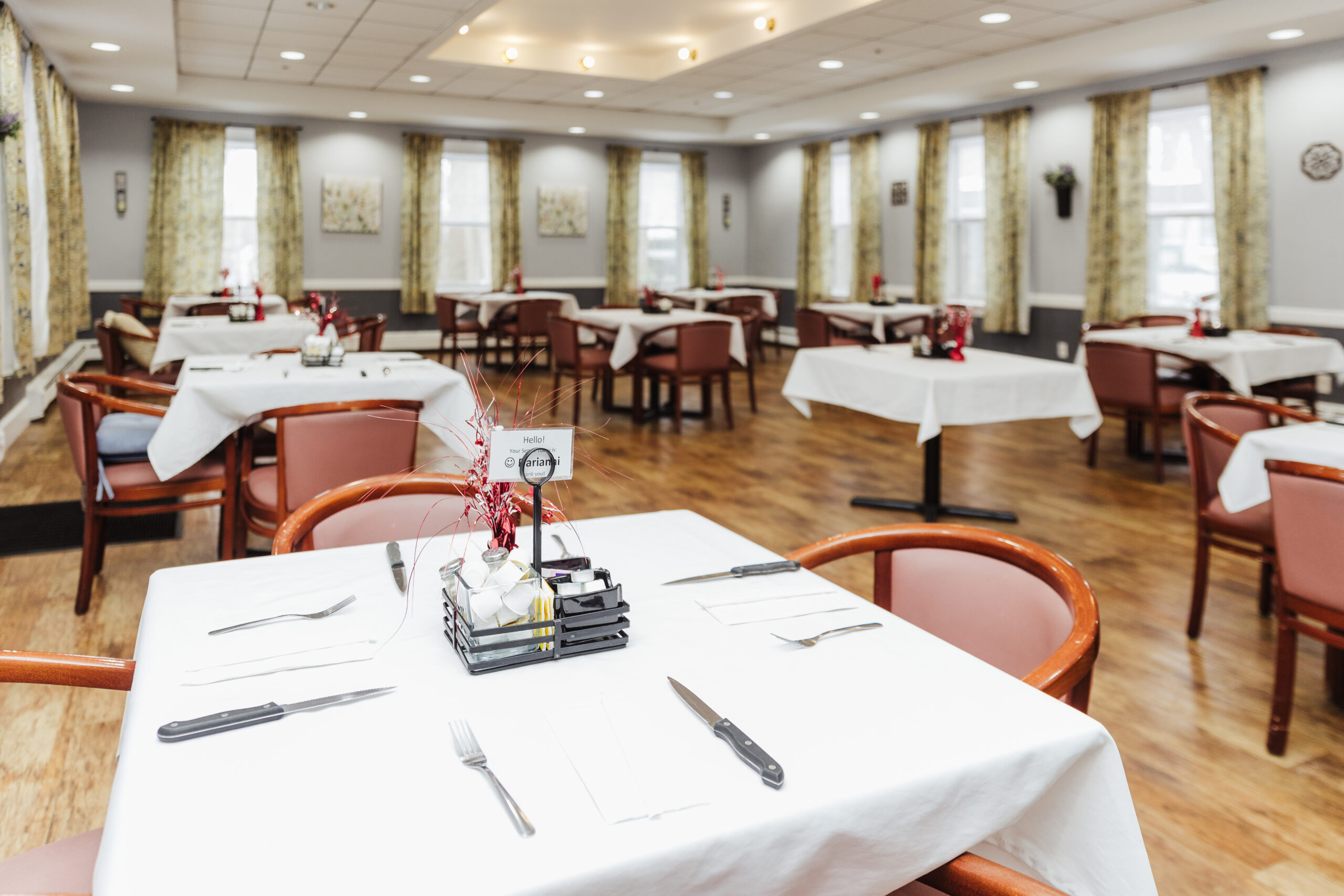 Bright dining room setup with tables and chairs