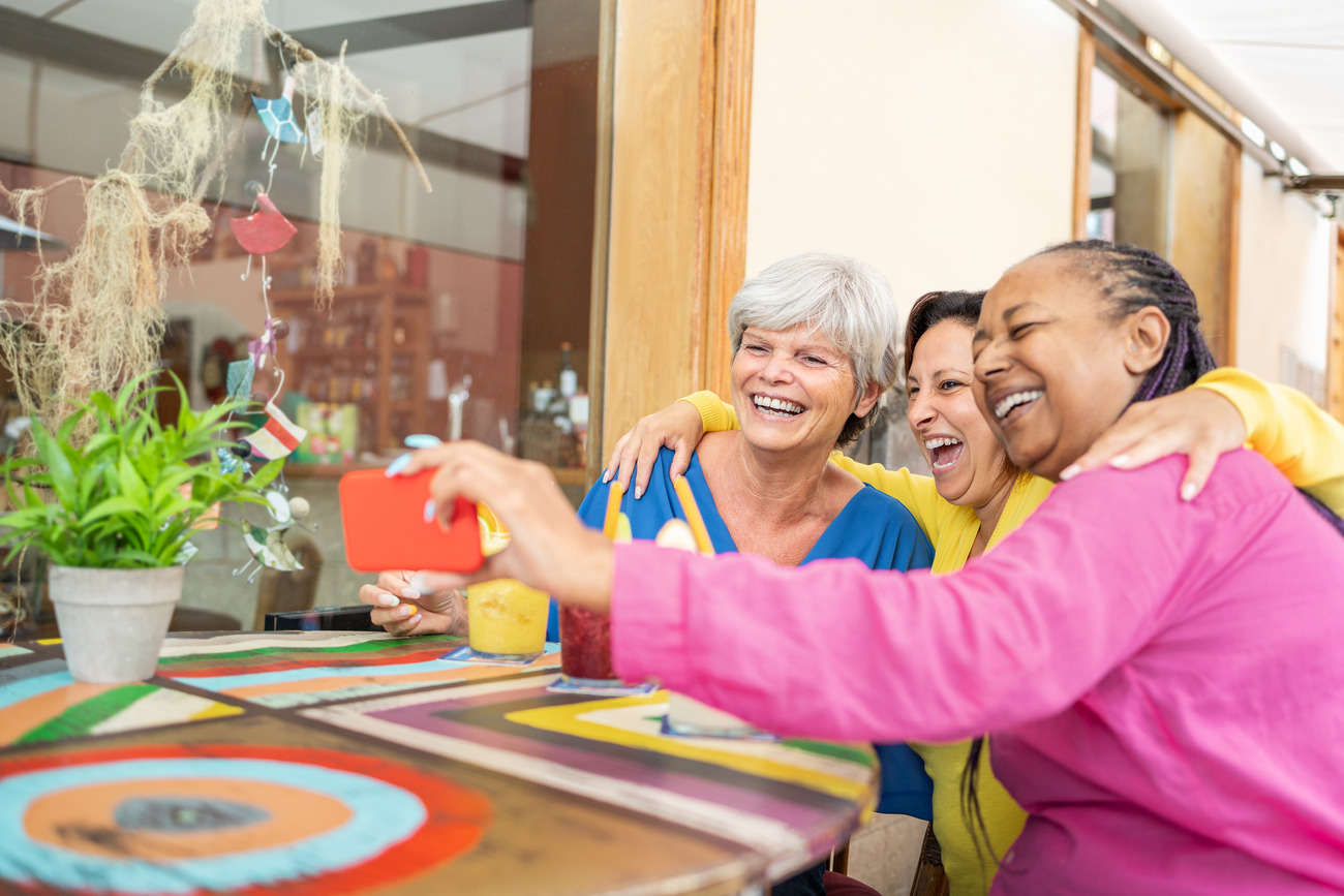 Residents enjoying a joyful moment at a colorful table