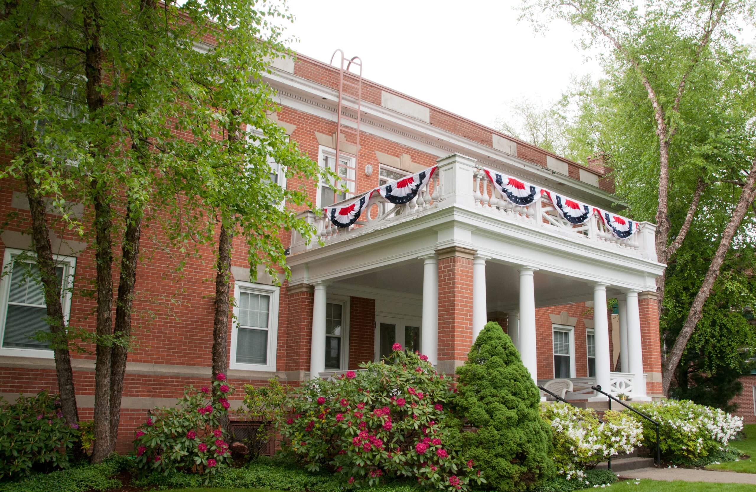 Exterior view of a nursing home building with landscaping
