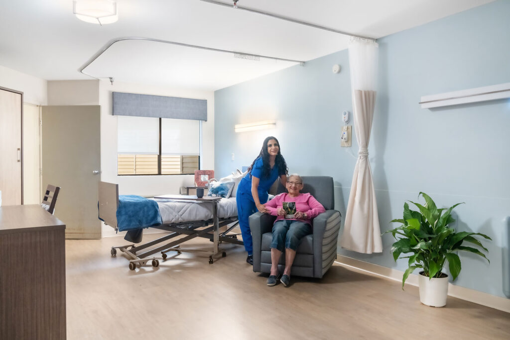 Staff member with resident in a cozy room