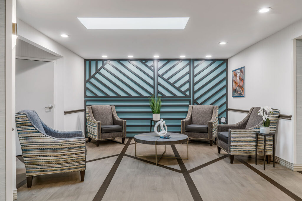 Bright common area with seating and decorative walls