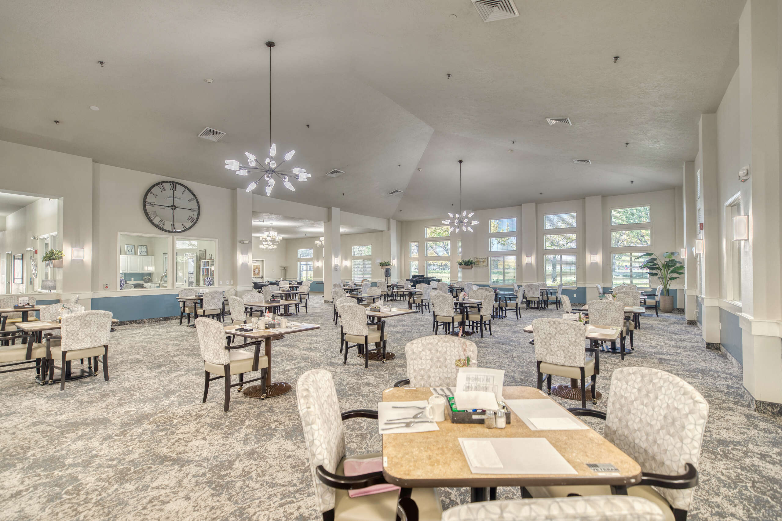 Bright and spacious dining area with tables and chairs