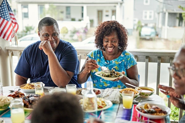 Residents enjoying a meal on a patio