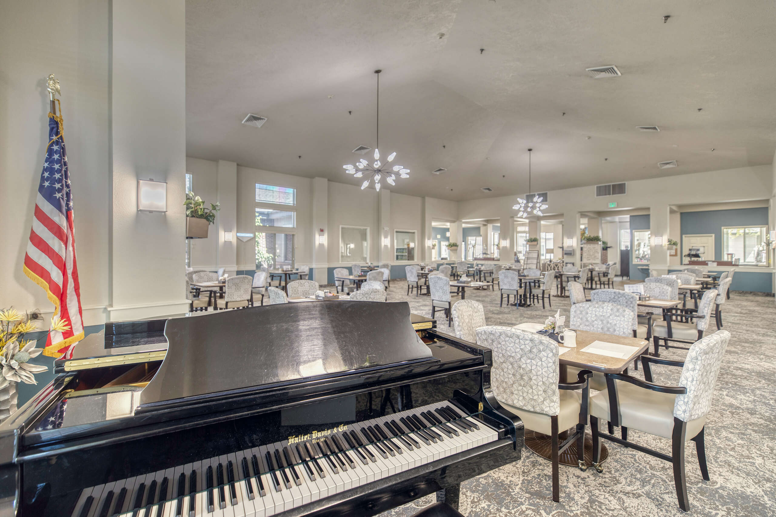 Interior view of a dining area with a piano and decor