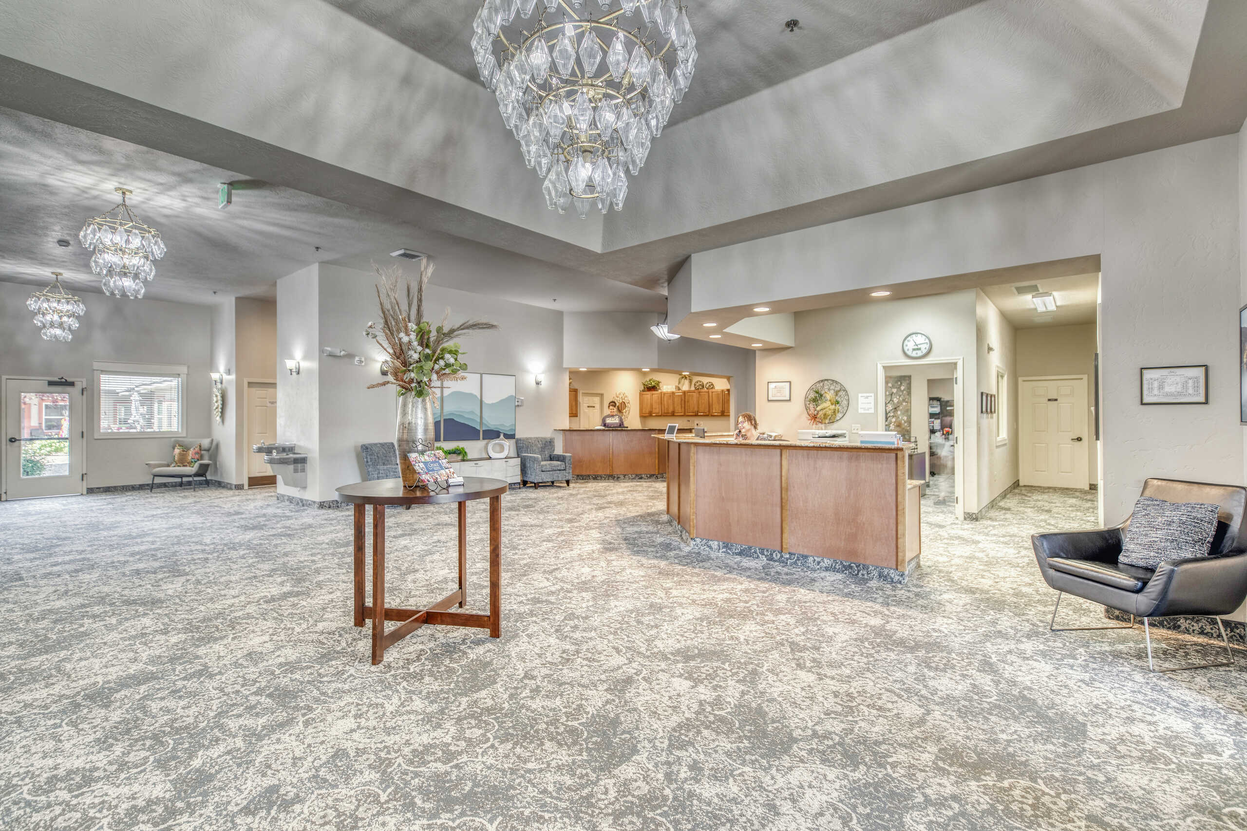 Bright lobby area with front desk and seating