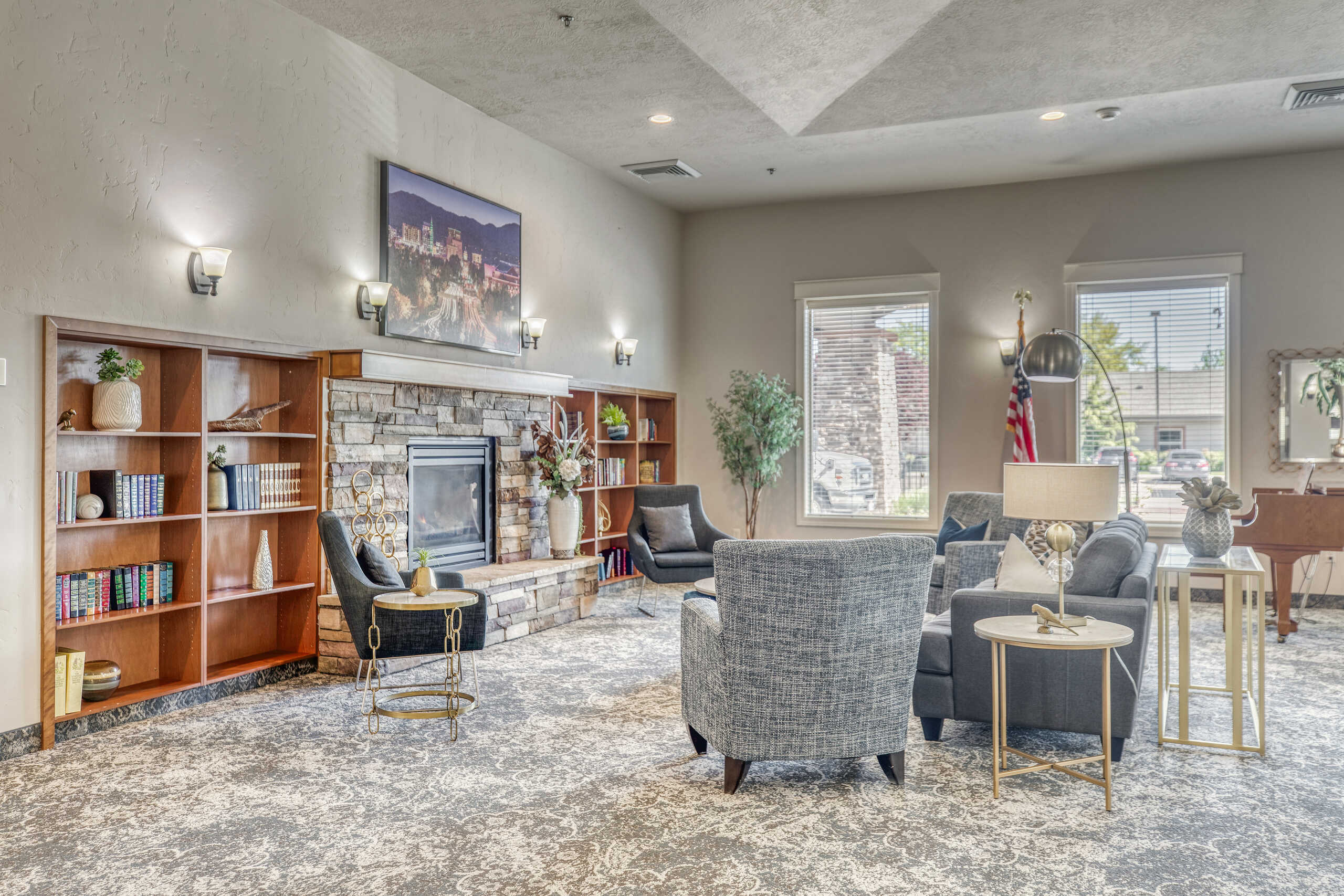 Bright and inviting common area with seating and a fireplace