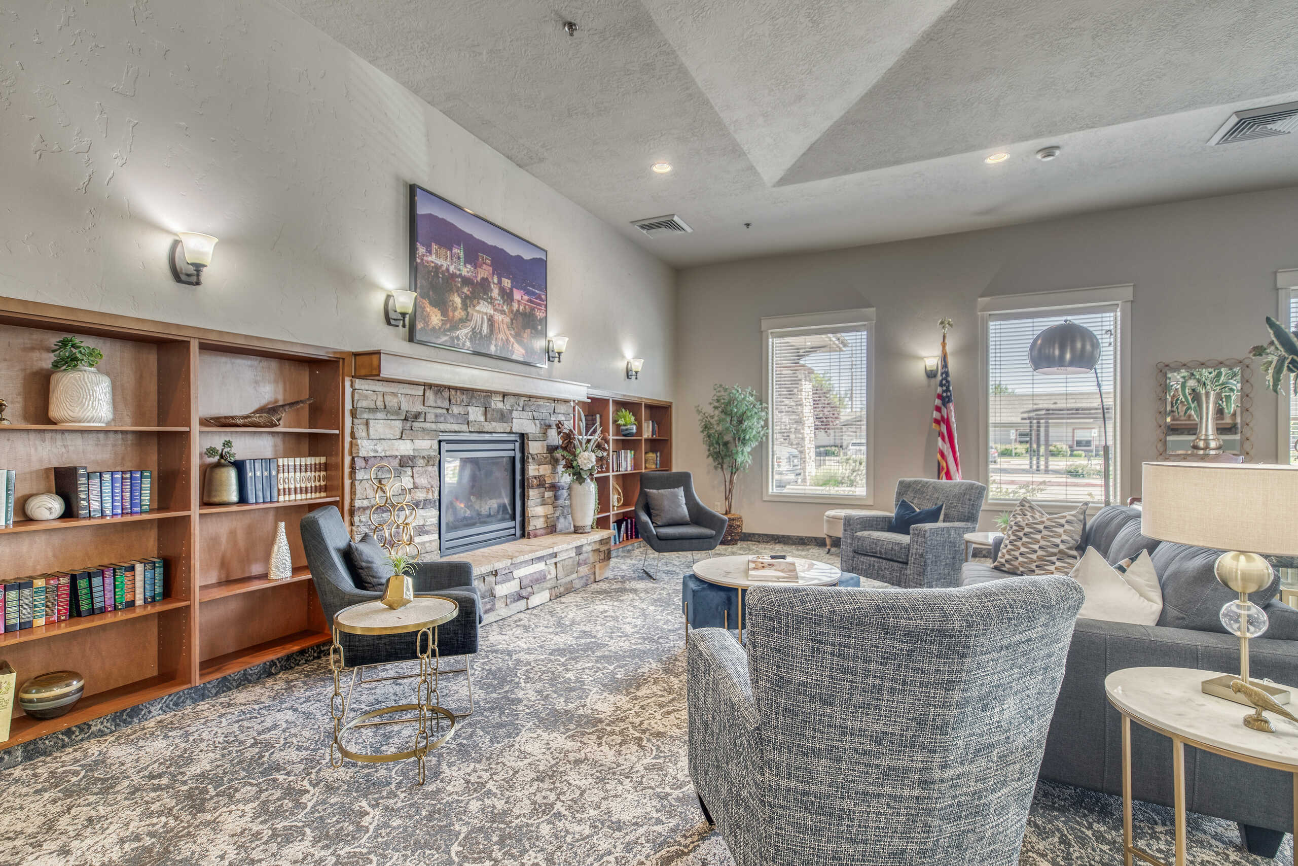 Interior common area with seating and a fireplace