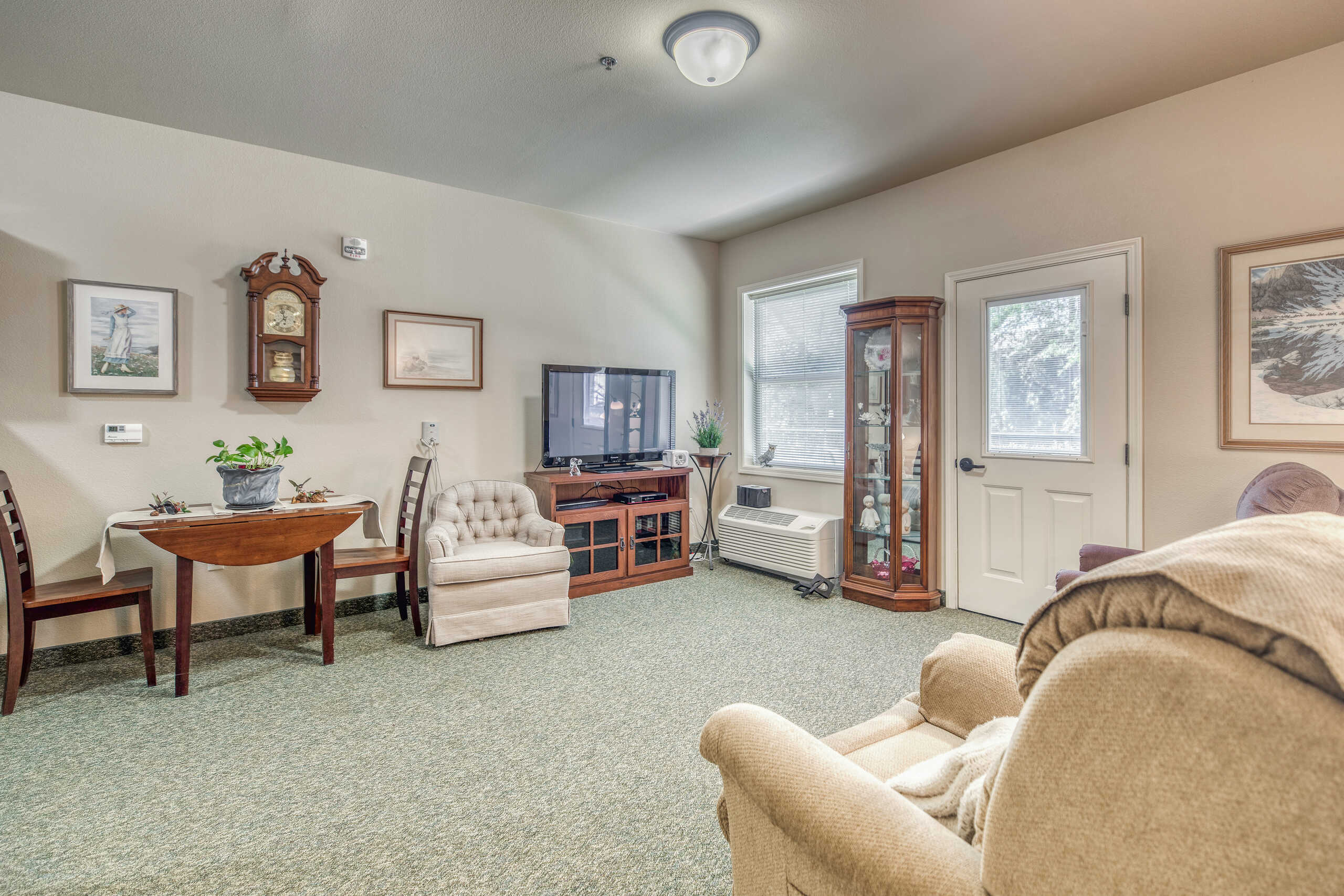 Comfortable interior of a resident room with furniture