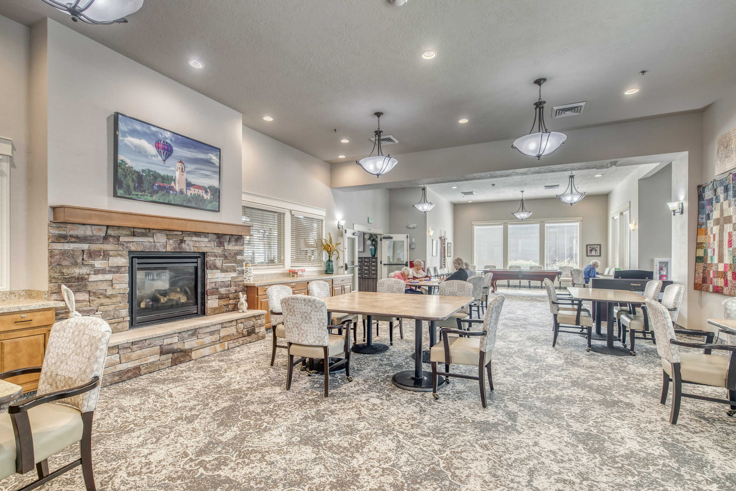 Bright common area with residents socializing