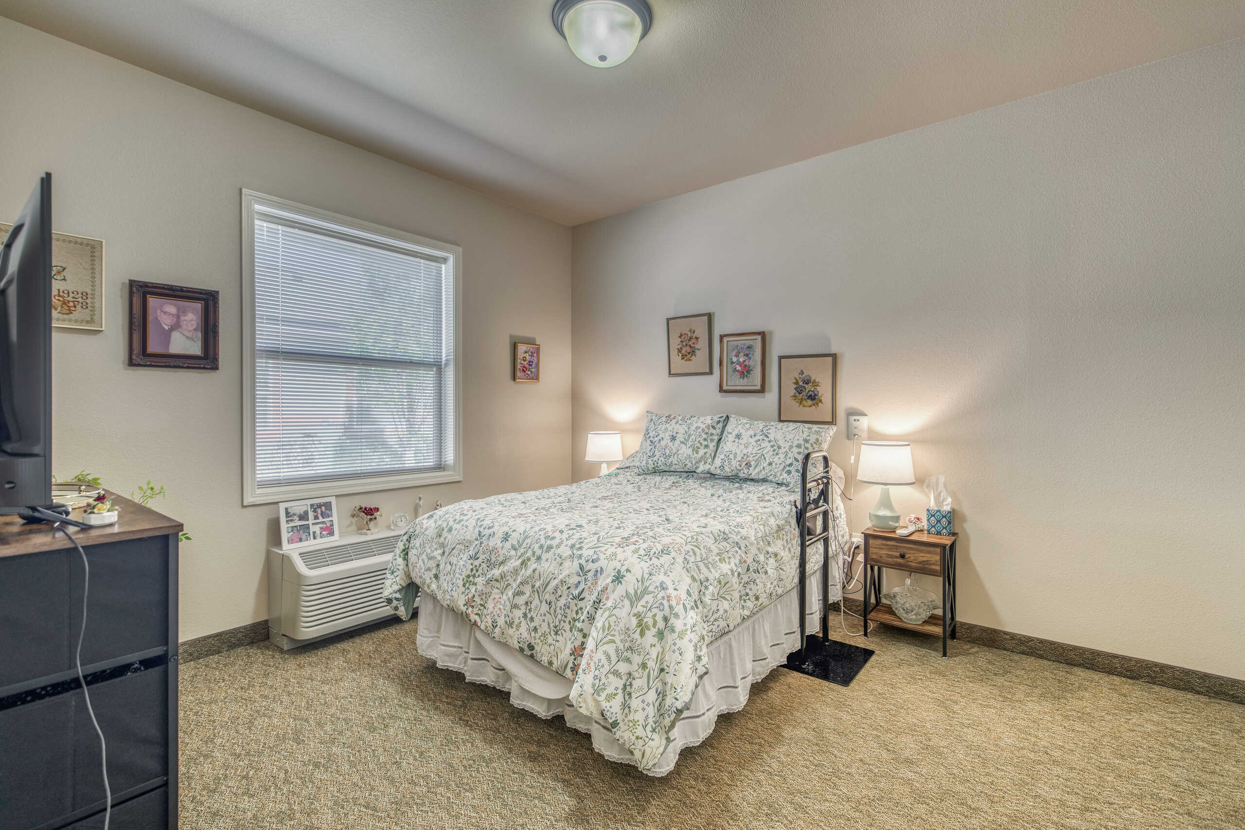 Cozy private resident room with floral bedding