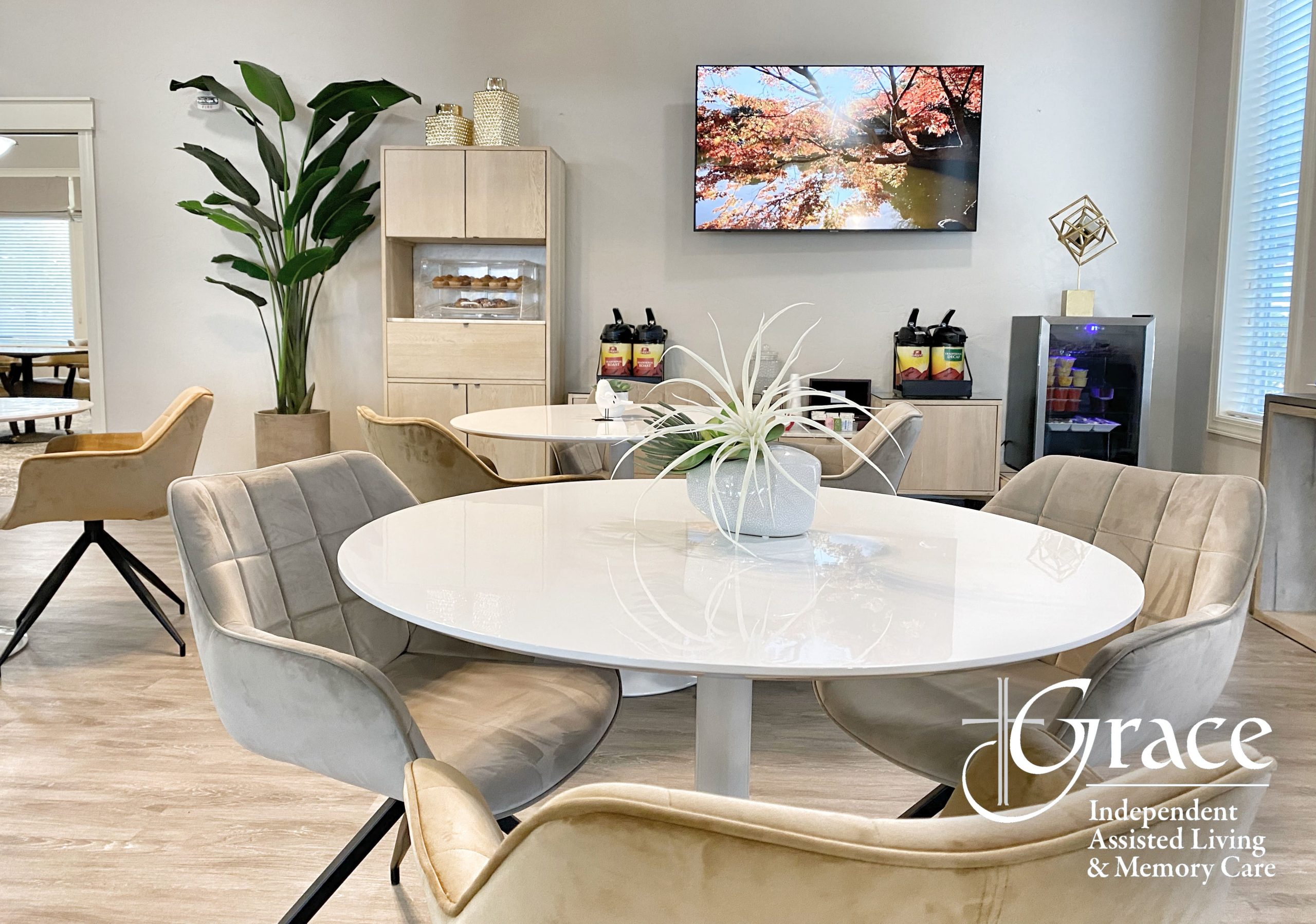 Bright common area with seating and nature view