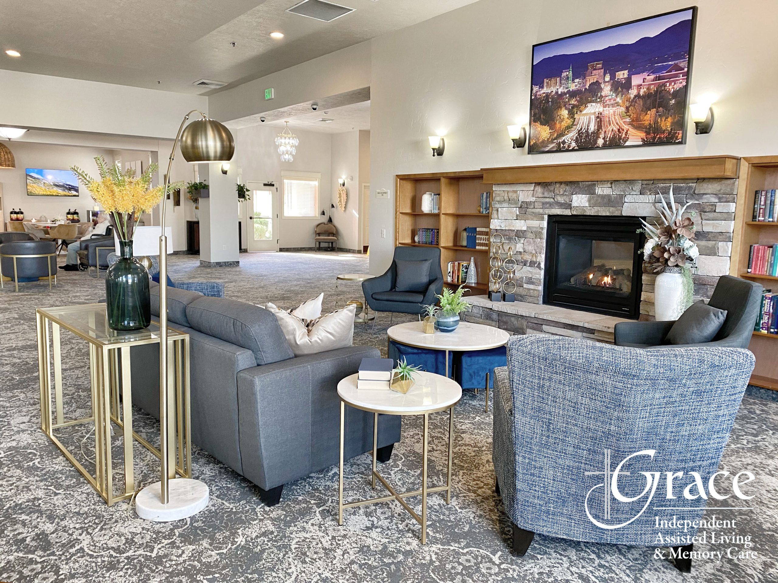 Comfortable lounge area with fireplace in assisted living facility