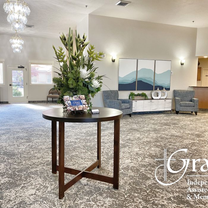 Welcoming lobby area with floral arrangement and seating
