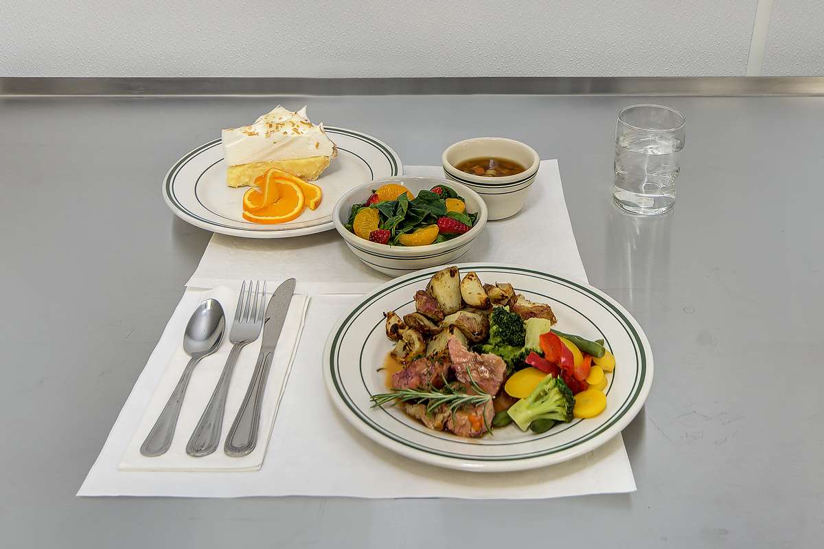 Plated meal with assorted food and dessert