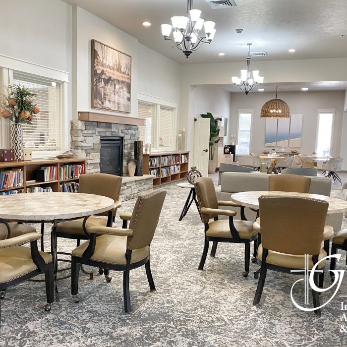 Interior view of a common area with seating and bookshelves