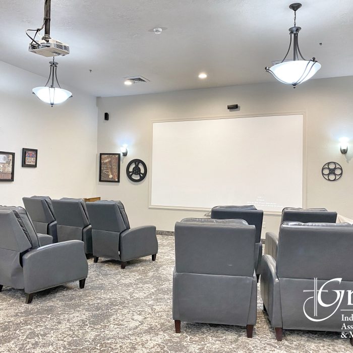 Interior of a small activity room with theater seating