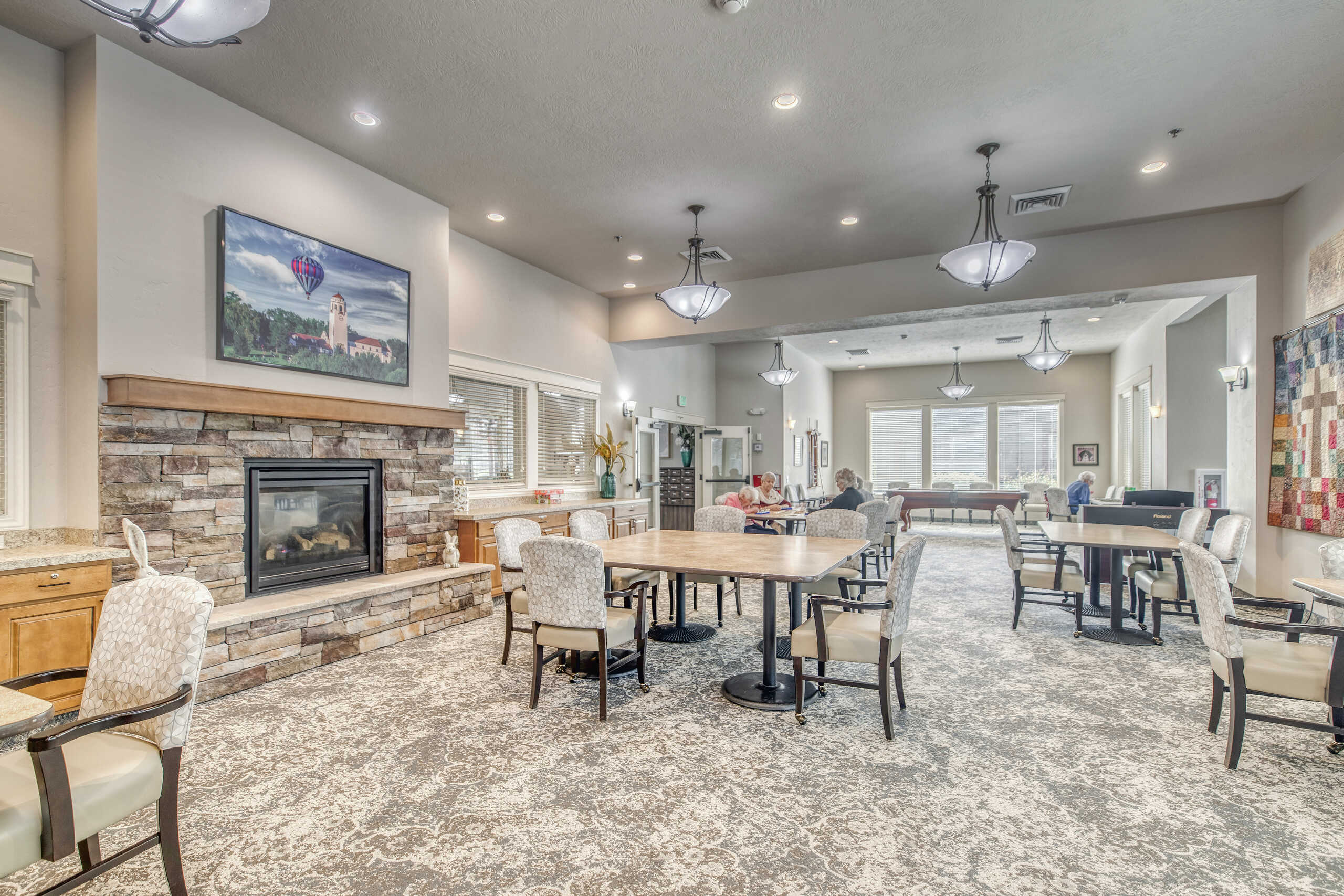 Interior dining area with residents and staff