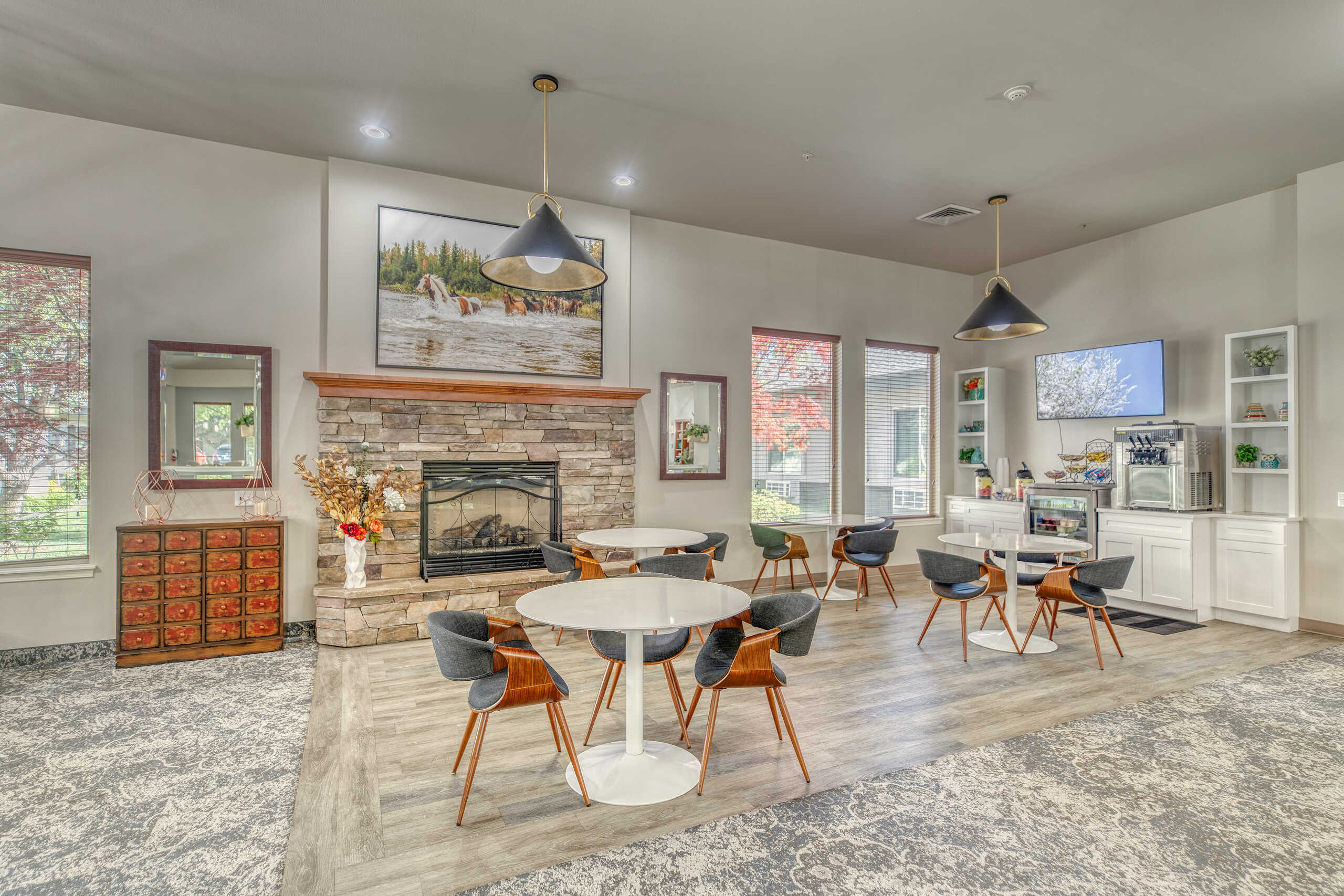 A cozy common area with seating and a fireplace