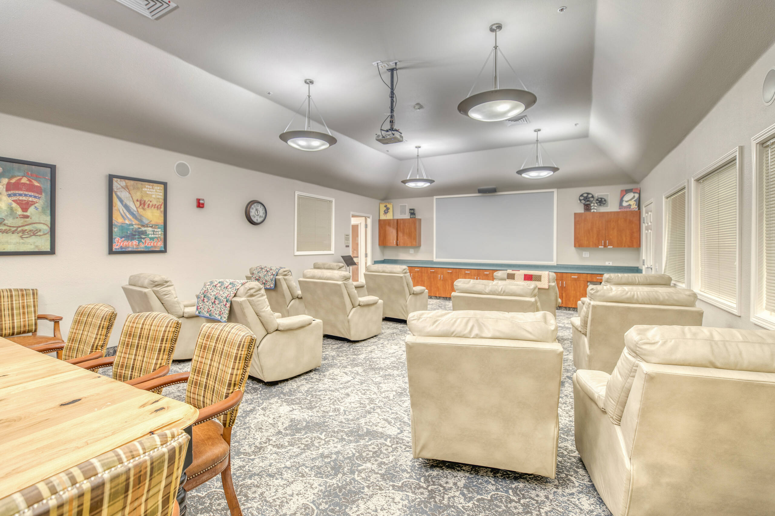 Interior common room with seating and projector