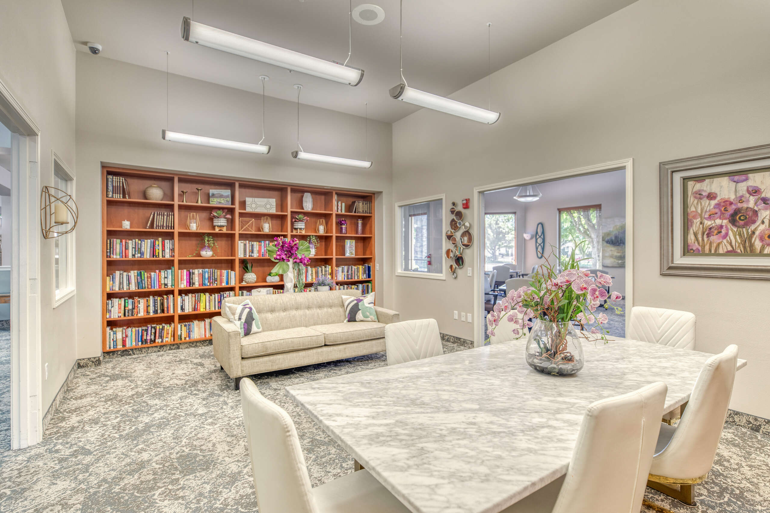 Common area with seating and bookshelves
