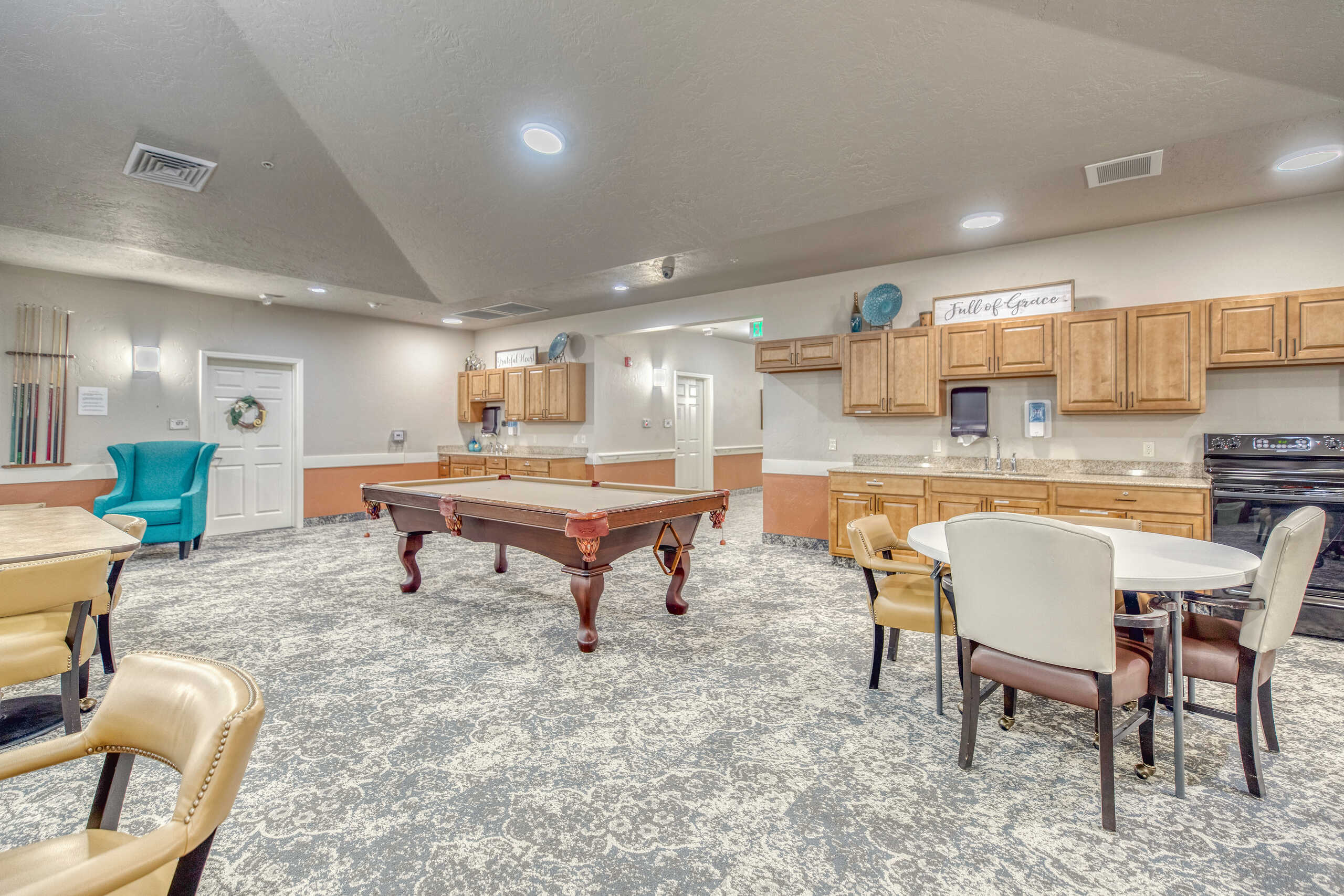 Interior common area with a pool table and seating