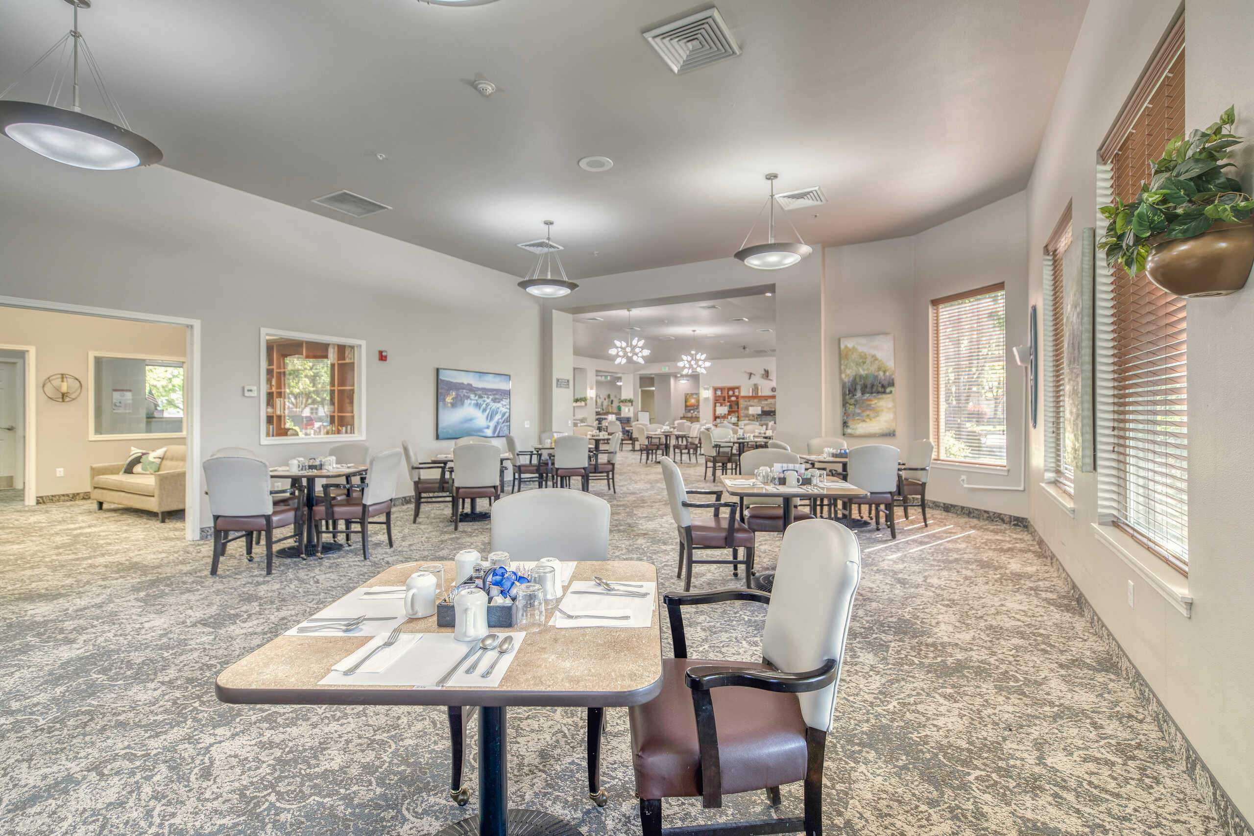 Bright dining area with tables and chairs