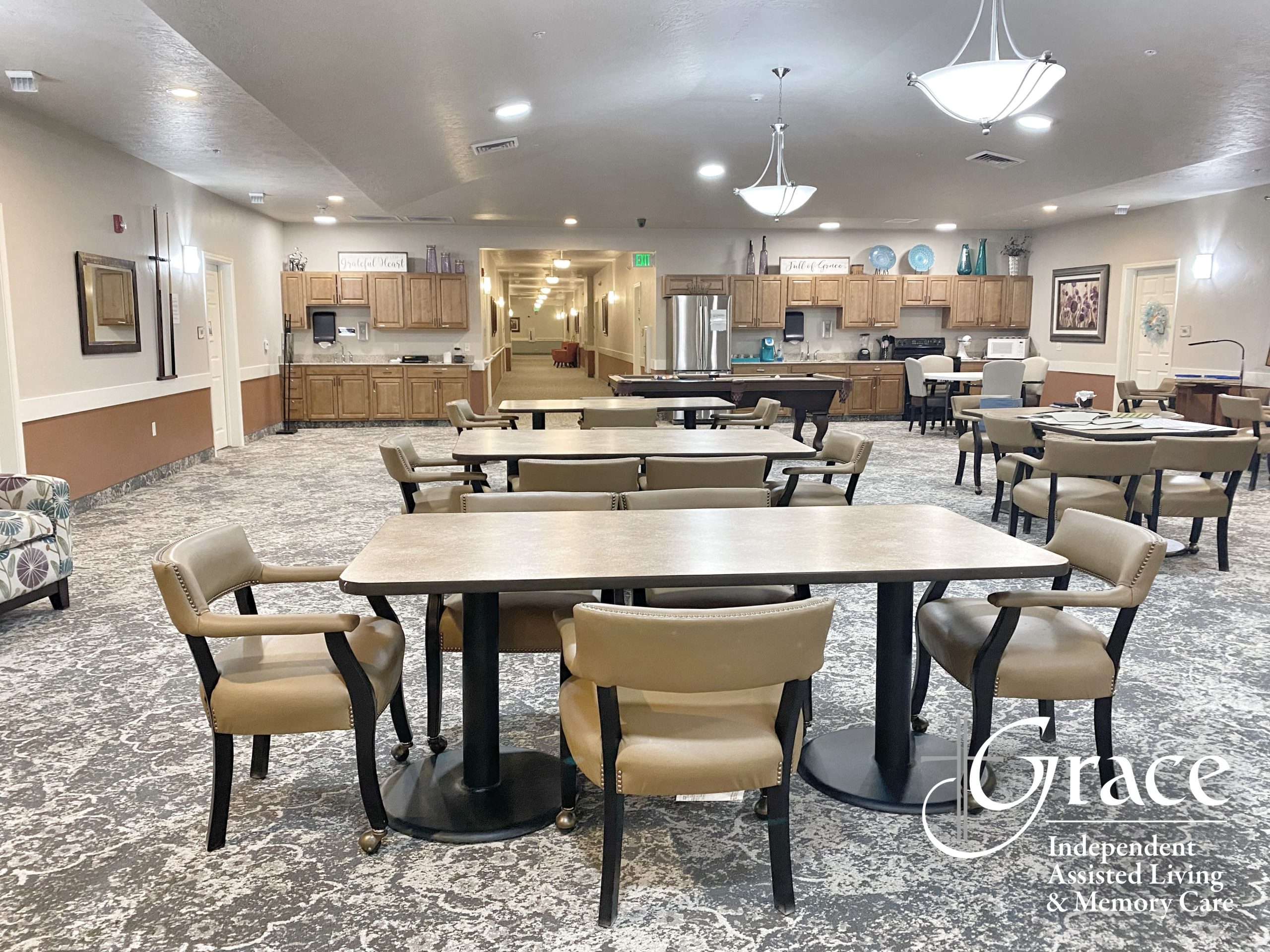 Spacious community common area with tables and chairs