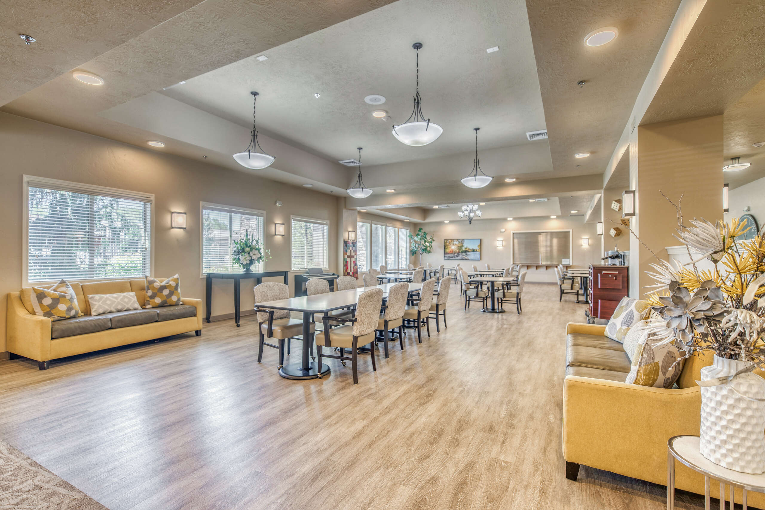 Interior view of a well-lit common area with comfortable seating